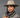 Ruana carranguera cuello tejido gris, detalle del cuello tejido a mano, mujer con sombrero de ala ancha en estudio.