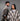 Ruana carranguera cuello en V gris y a cuadros, pareja en estudio.